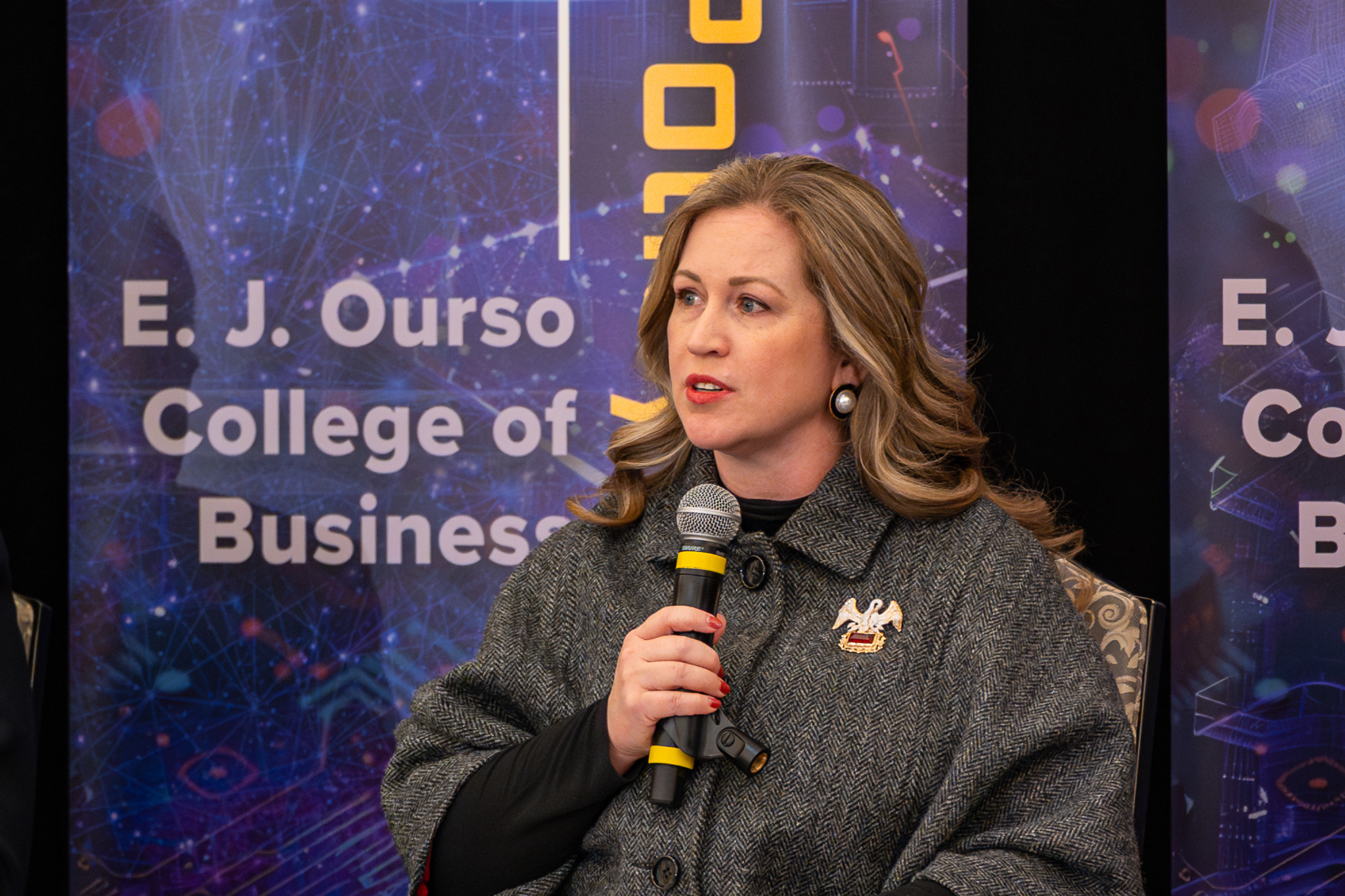 Erin Bendily speaking at the AI in Action Symposium.