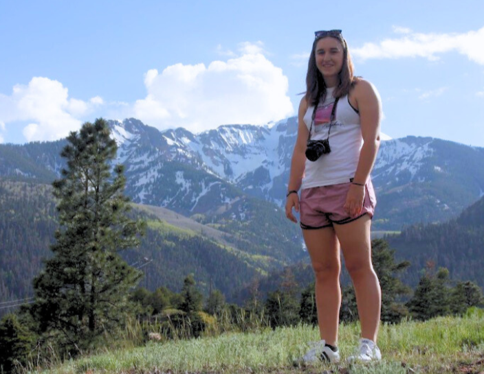 Remington Gillis in front of mountains