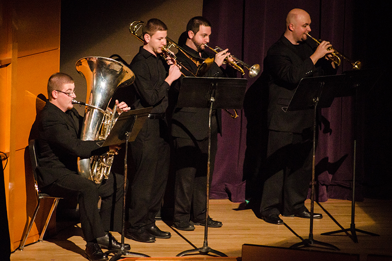 students performing on stage