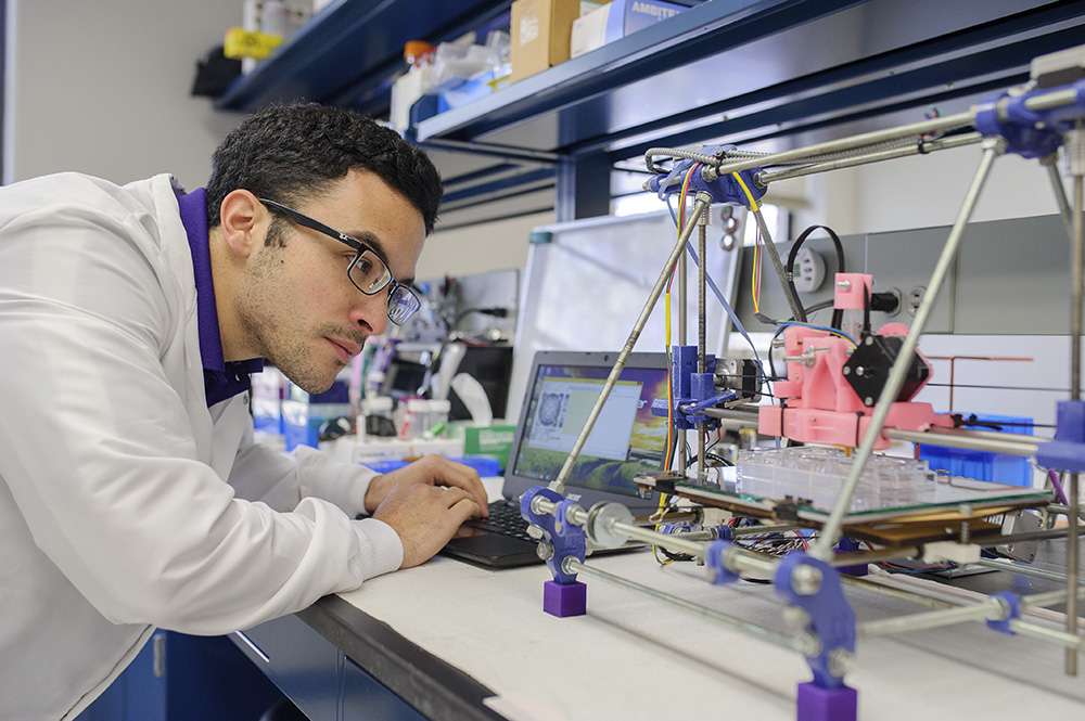 Student looking at vials