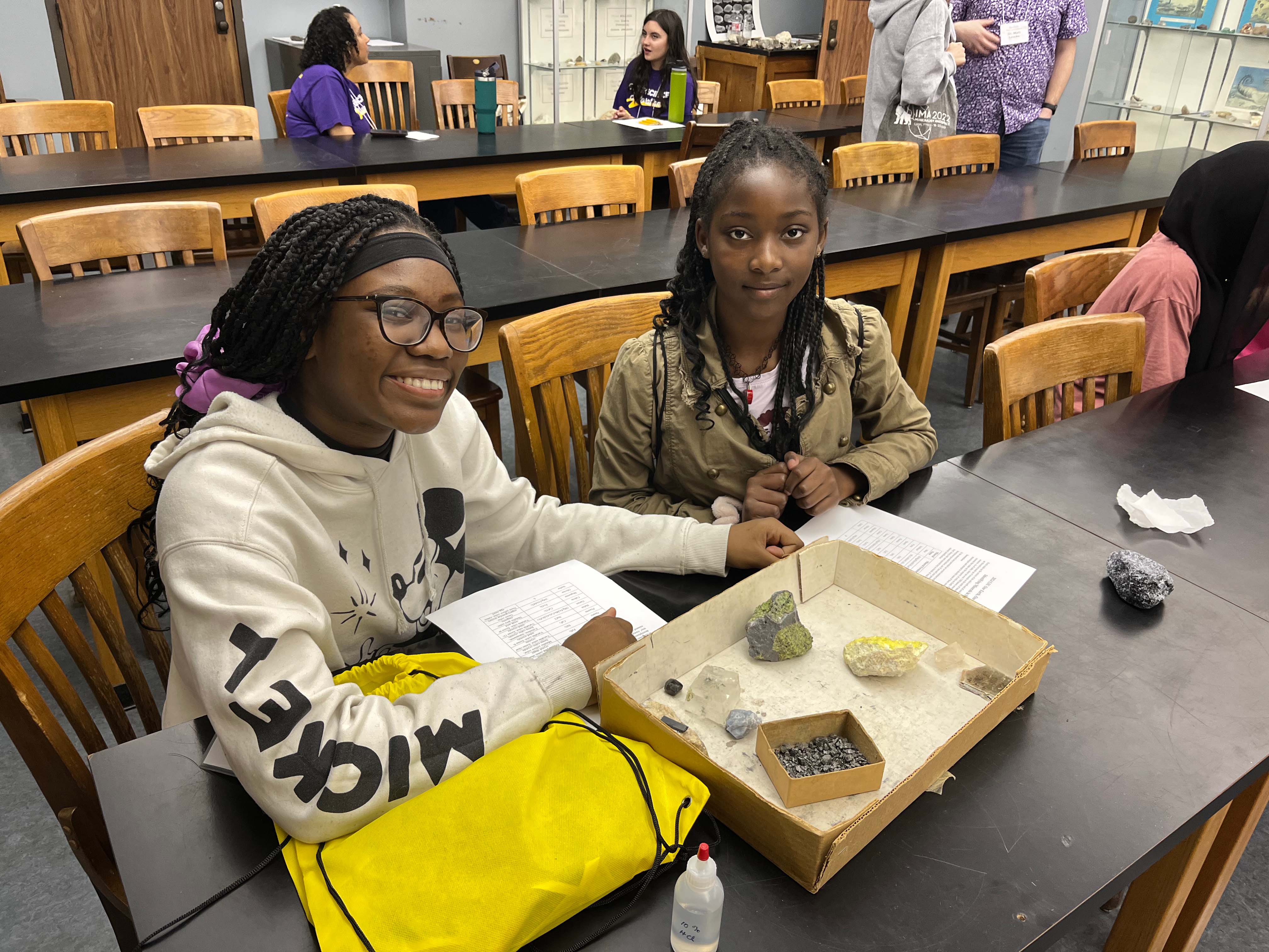 girls identifying mineral samples