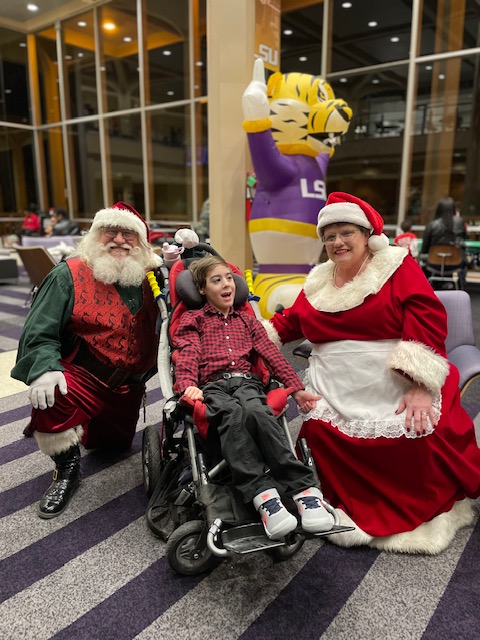 Santa Claus and Mrs. Claus with children