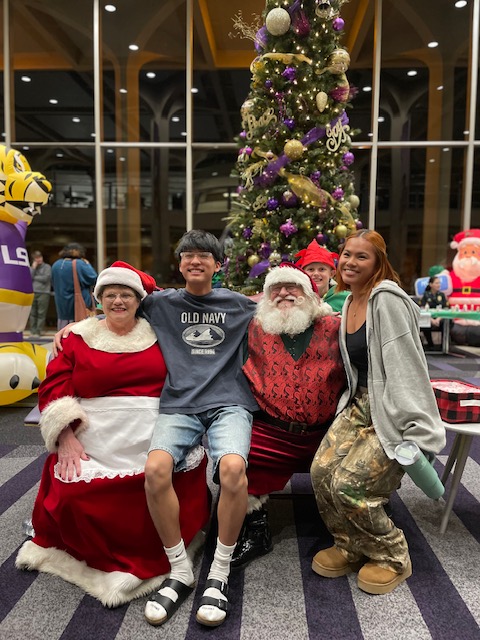 Santa Claus and Mrs. Claus with children