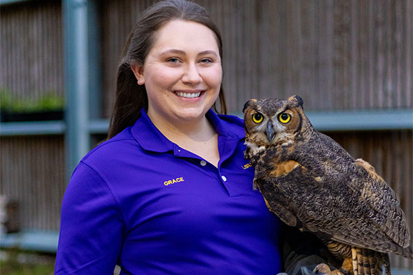 Grace Miller with great horned owl